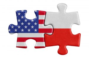 Połączone puzzle z flagami USA i Polski